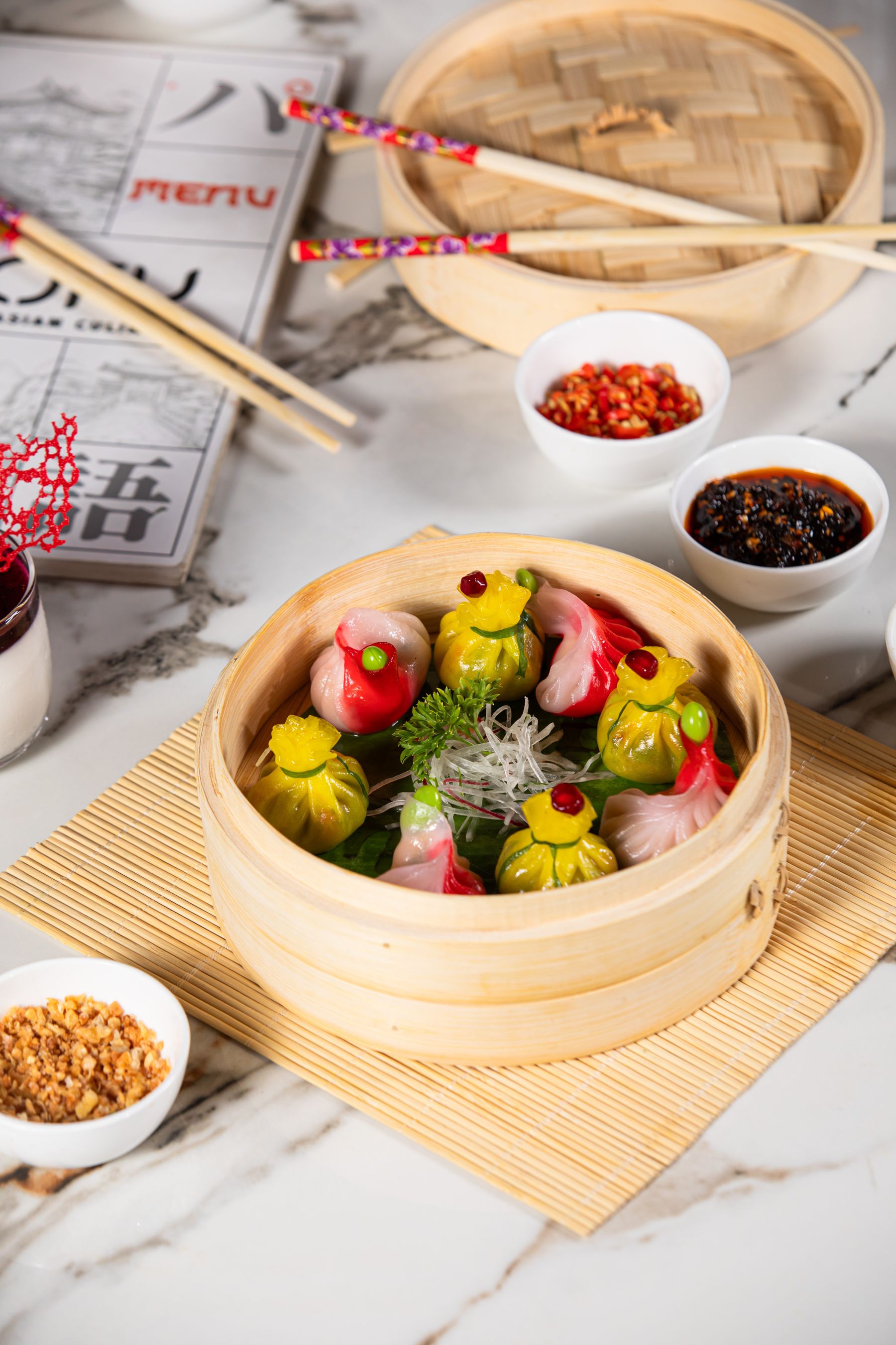 Colourful dim sums in a bamboo steamer